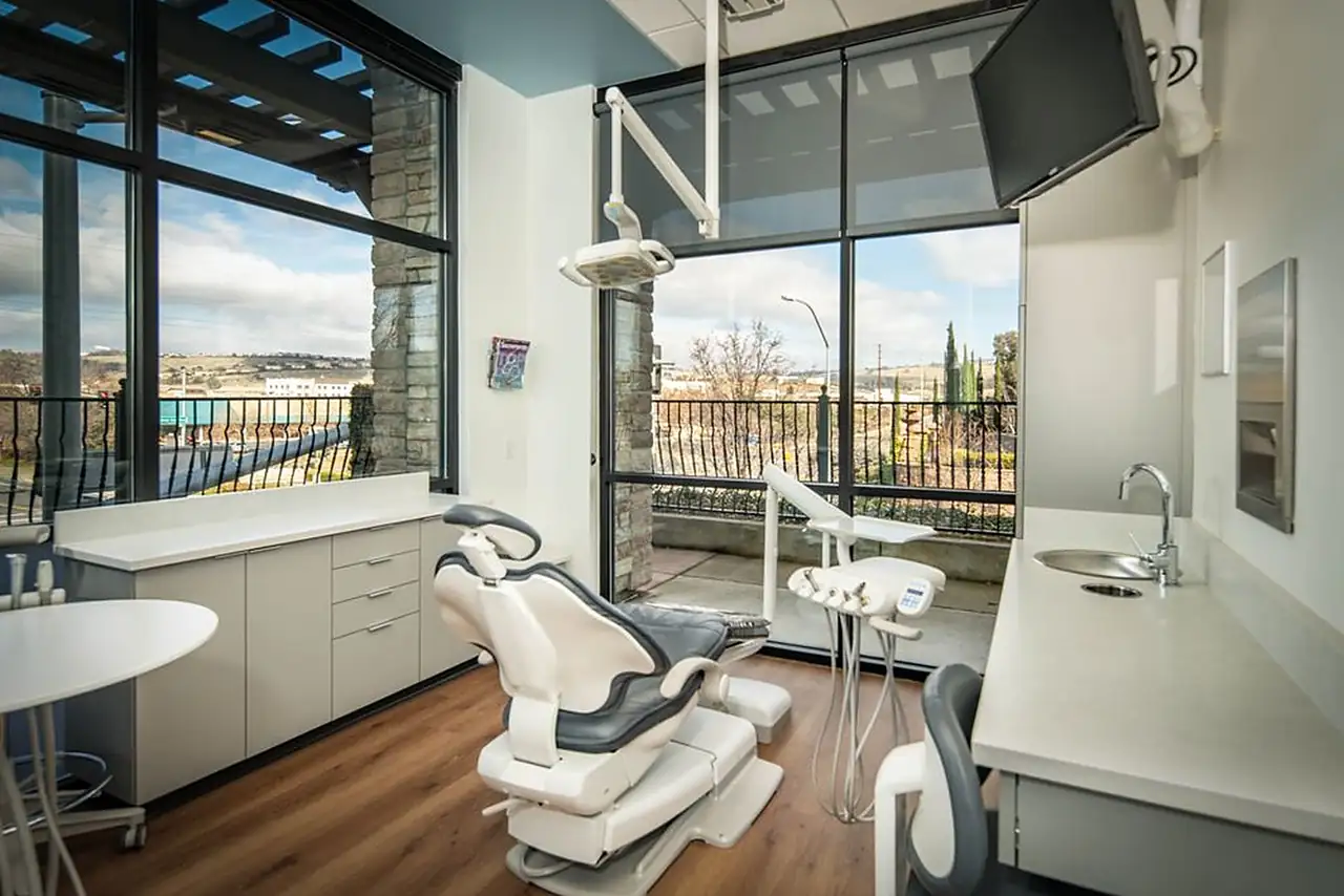 A treatment room at Golden Hills Family Dental, with floor-to-ceiling windows looking out over El Dorado Hills.
